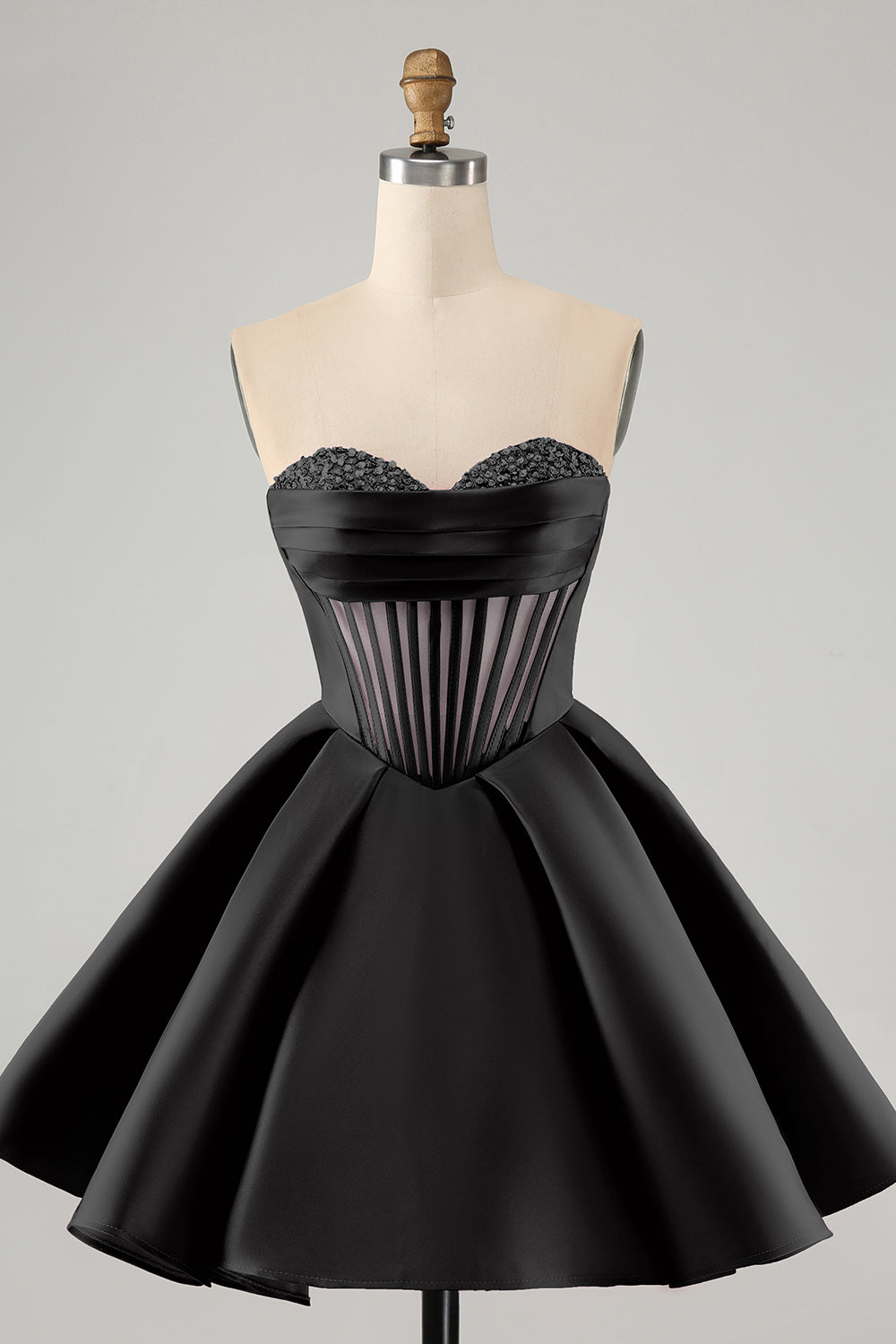 Jolie robe de soirée courte fuchsia à décolleté en cœur et corset avec perles