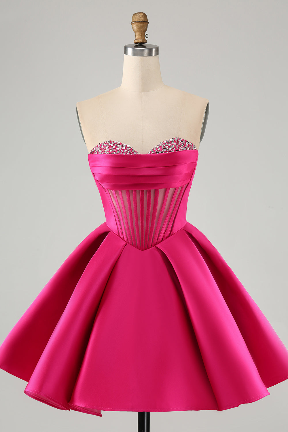 Jolie robe de soirée courte fuchsia à décolleté en cœur et corset avec perles