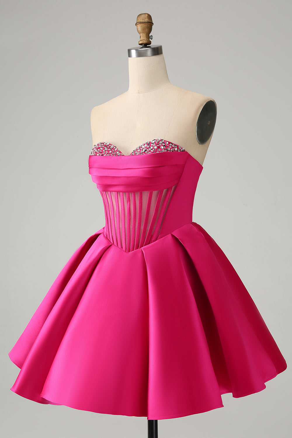 Jolie robe de soirée courte fuchsia à décolleté en cœur et corset avec perles