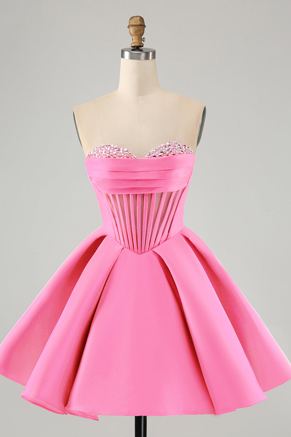 Jolie robe de soirée courte fuchsia à décolleté en cœur et corset avec perles