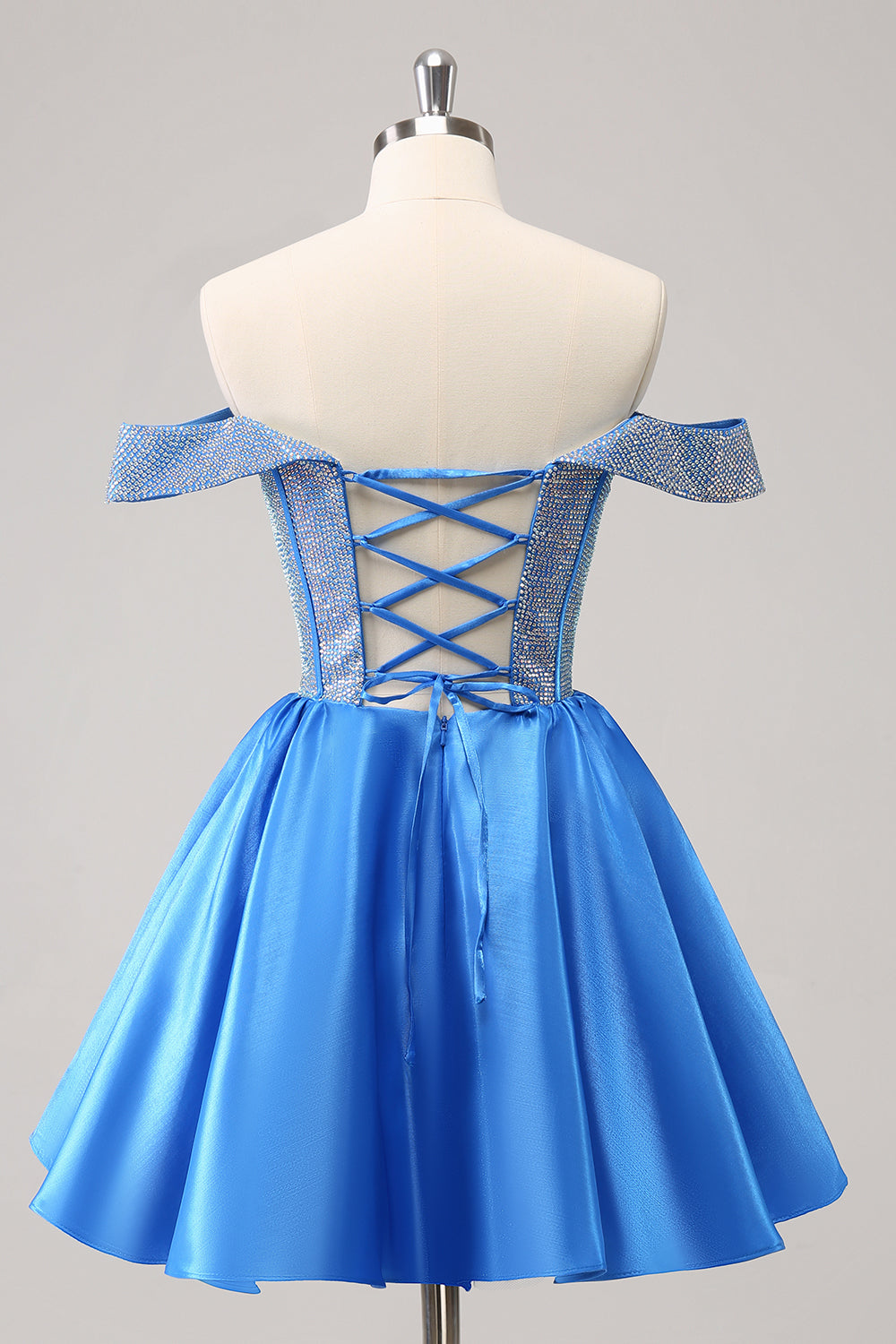 Jolie robe de soirée bleue style corset à épaules dénudées et perles