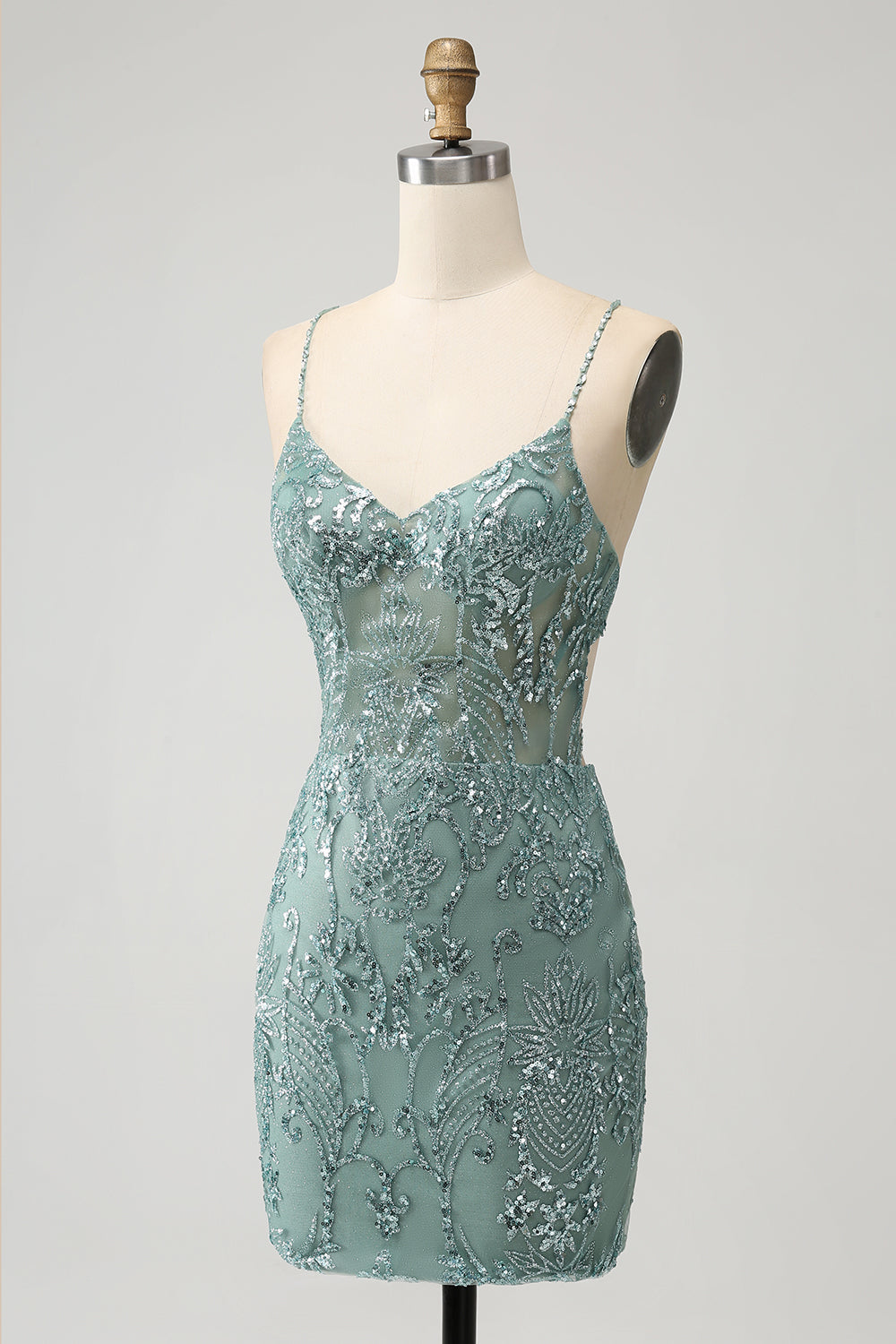 Robe de soirée courte moulante verte à dos nu et perles croisées dans le dos