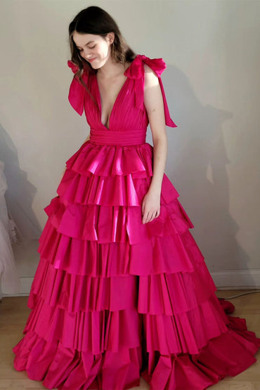 Robe de bal fuchsia à volants et décolleté en V plongeant avec bretelles et nœud