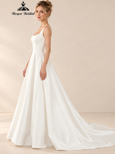 Side view of an ivory A-line satin wedding dress with square neckline and flowing floor-length skirt.