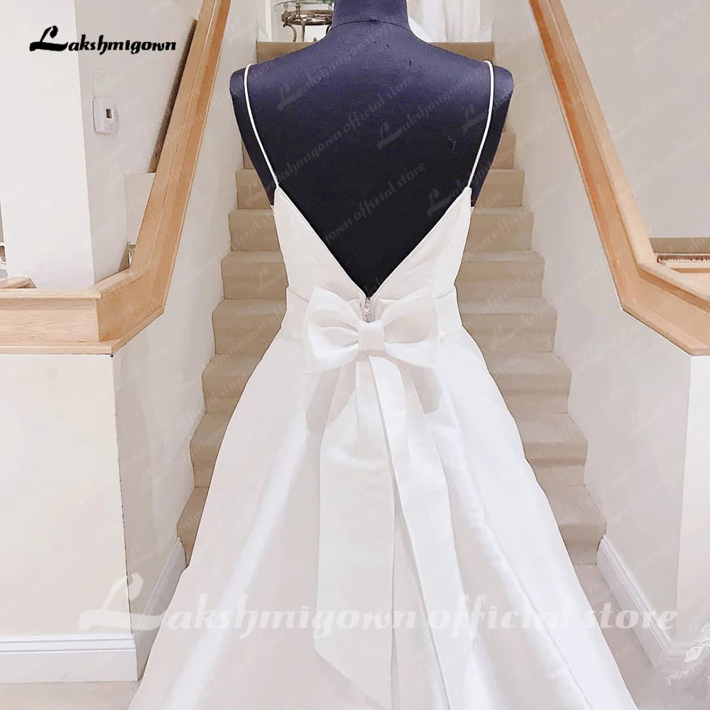 Lakshmigown Satin A Line Wedding Dresses with Bow Backless 2023 Summer Beach Robe Satin Sexy Bridal Gowns Spaghetti Straps