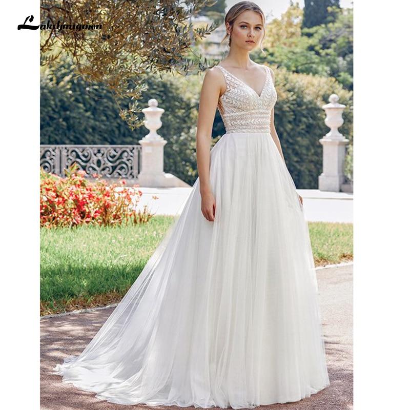 Bohemian Wedding Dresses 2021 V Neck Sexy Sleeveless Lace Applique Backless A Line Wedding Gown Soft Tulle Bridal Dress