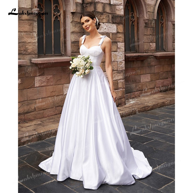 A-Line/Princess Soft Satin Wedding Dresses Low Sweetheart Neck Ruffles Straps Sleeveless Sweep/Brush Train Simple Bride Gown