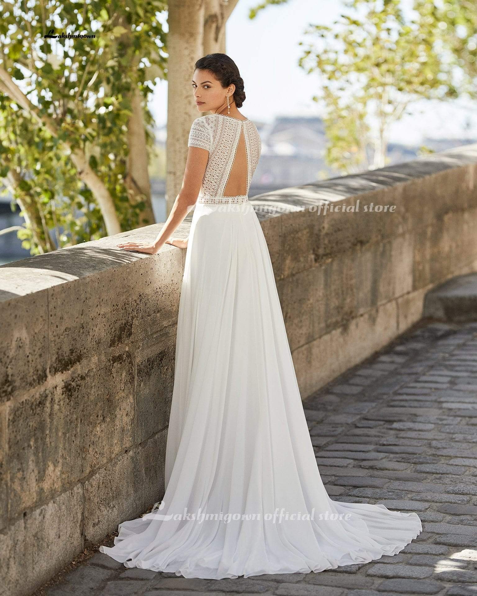 https://www.roycebridal.com/cdn/shop/products/simple-cap-short-sleeve-beach-wedding-dress-lace-bodice-31598729822357.jpg?v=1629455296